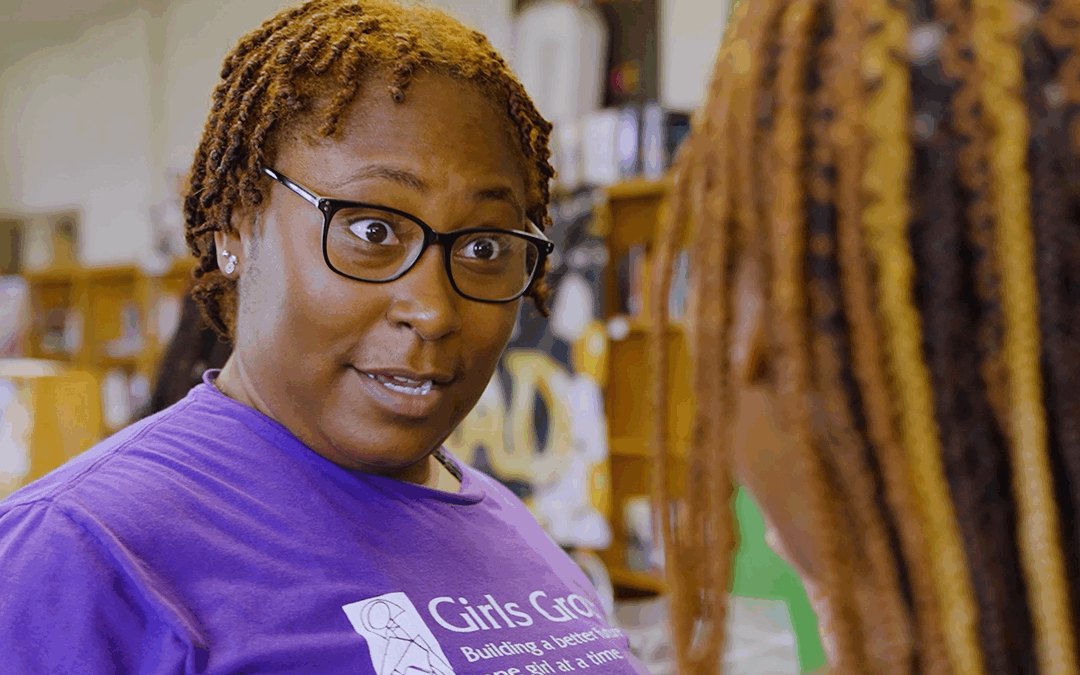 Girls Group staff person engaging a young woman in their program