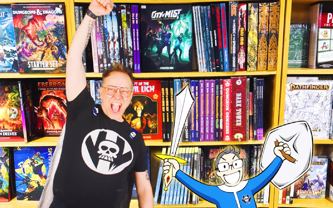 Super Curtis from Vault of Midnight with fist in the air next to comic Curtis with a sword, both in front of graphic novels in one of their stores.